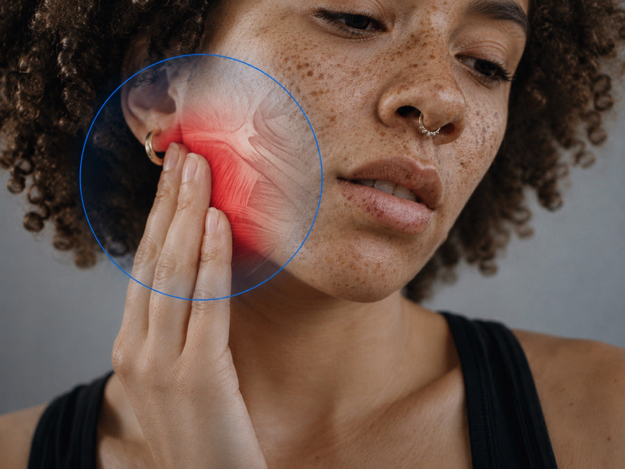 Temporomandibular joint pain highlighted on the jaw